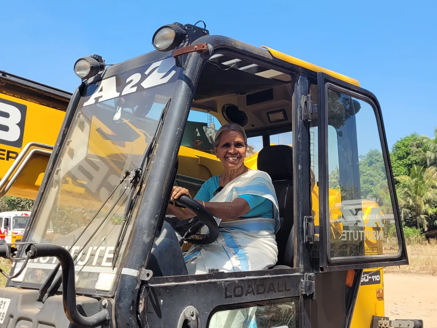 Radhamani Amma at the wheel of a JCB Loadall telehandler at A2Z Institute, Kochi